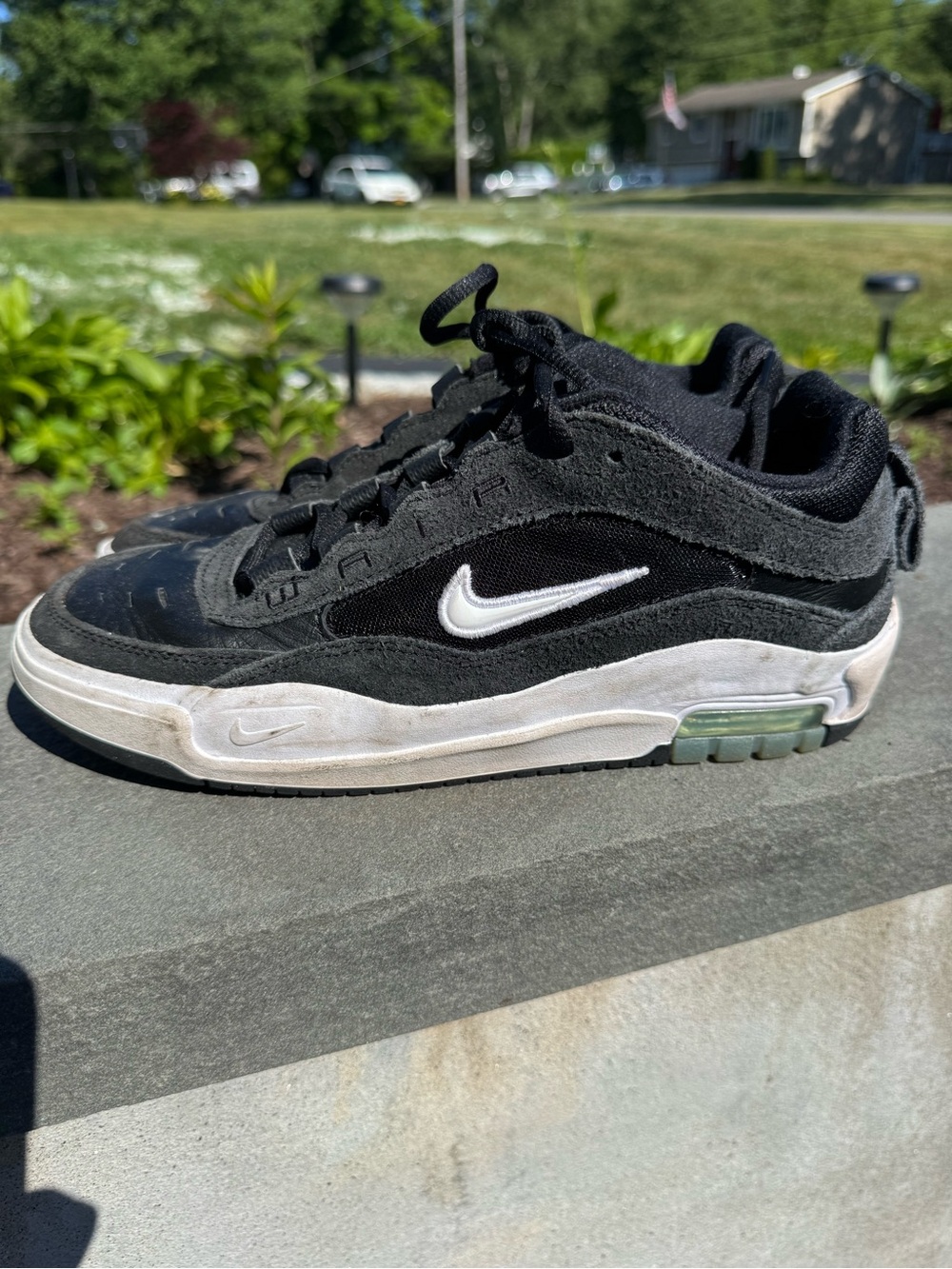 Nike Black and White Suede Low-Top Sneakers with Green Accent